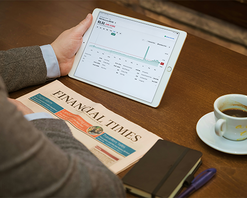 Person reviewing financial information on a tablet