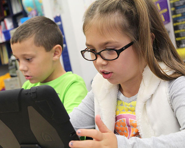 Students using tablets in a classroom