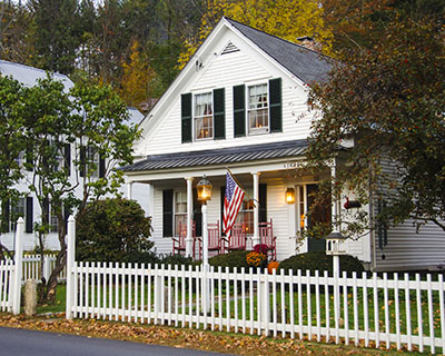 White two-story home with a front porch