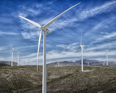 Wind turbines across a rural landscape