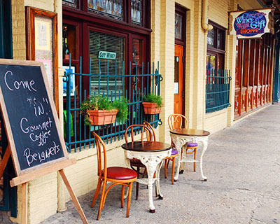 Small-town storefront with outdoor café seating